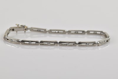 Lot 1135 - A white metal diamond set bracelet, set with...