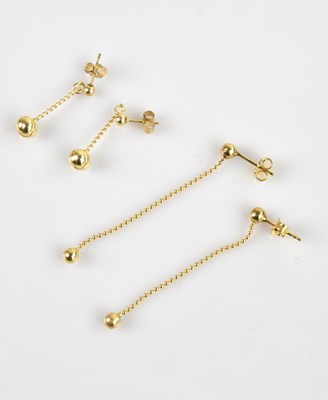 Lot 1436 - A pair of yellow metal drop earrings, stamped '...