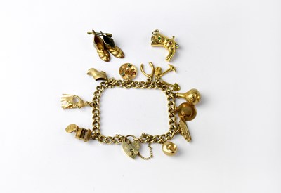 Lot 1118 - A 9ct gold charm bracelet with 9ct gold...