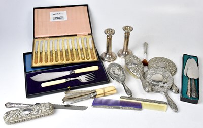 Lot 700 - A cased set of twelve butter knives with...