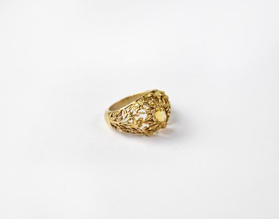 Lot 1050 - A 9ct gold openwork ring set with yellow stone,...