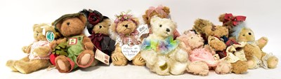 Lot 227 - A collection of modern teddy bears dressed in...