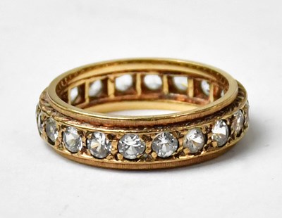 Lot 1026 - A 9ct yellow gold eternity ring set with white...