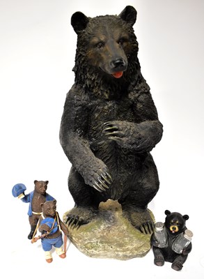Lot 418 - A resin model of a bear in a standing position,...
