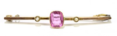 Lot 1458 - A 9ct yellow gold bar brooch set with pale...