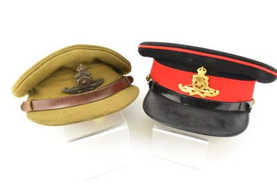 Lot 601 - Two Royal Artillery pre-1950 dress caps, with...