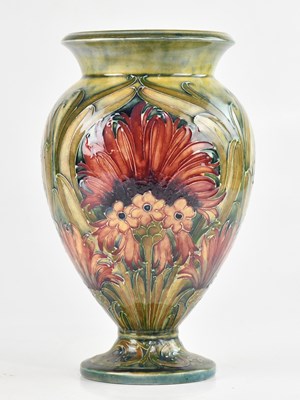 Lot 5 - WILLIAM MOORCROFT; a pedestal vase in the...
