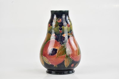 Lot 32 - WILLIAM MOORCROFT; an early gourd shaped vase...
