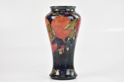 Lot 33 - WILLIAM MOORCROFT; a large tapering vase of...