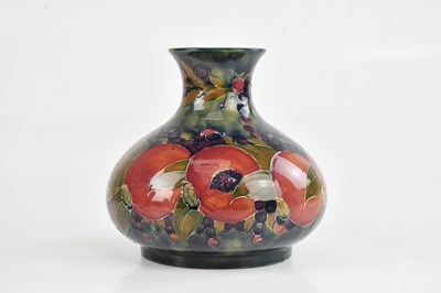 Lot 6 - WILLIAM MOORCROFT; a large early squat vase in...