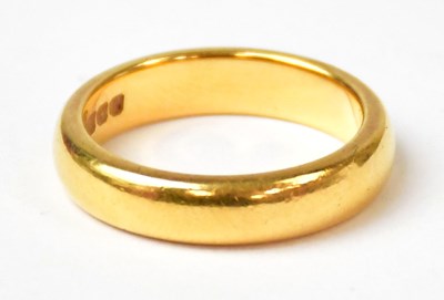 Lot 988 - A 22ct yellow gold wedding band, size N,...