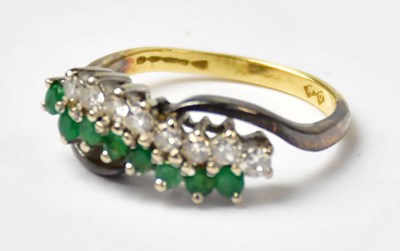 Lot 678 - An 18ct yellow gold ring set with a double...