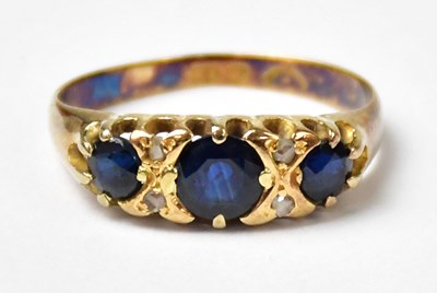 Lot 999 - An 18ct yellow gold ring set with three...