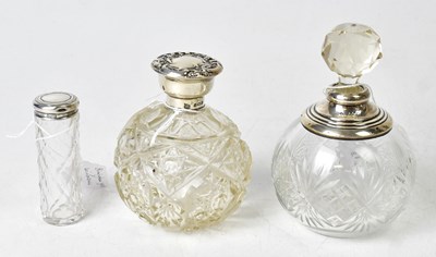 Lot 724 - Three Edwardian and later silver-topped cut...