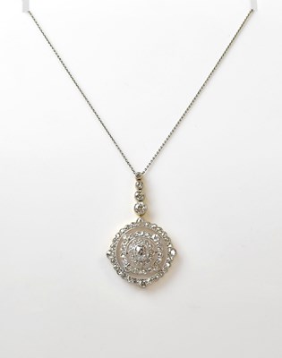 Lot 1089 - An Edwardian yellow metal diamond pendant of...