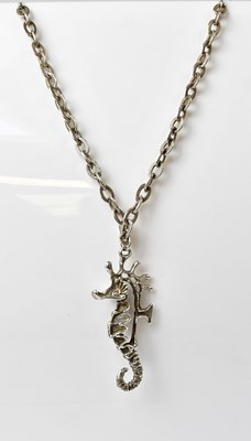 Lot 1106 - A mid-century silver openwork seahorse pendant,...