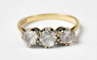 Lot 1018 - A 9ct yellow gold ring set with three white...