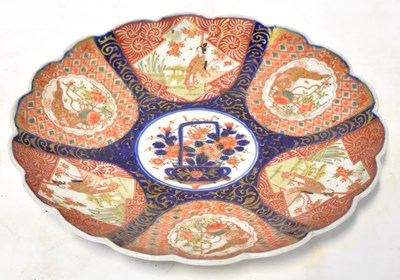 Lot 188 - A Japanese Imari scalloped edge dish, painted...