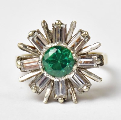 Lot 1022 - A 9ct yellow gold ring set with a central...