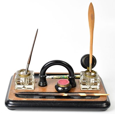 Lot 252 - A 19th century ebonised walnut desk stand with...