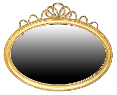 Lot 99 - A Neoclassical style gilt oval wall mirror...