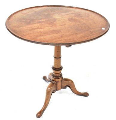 Lot 14 - A George III oak tilt-top circular side table...