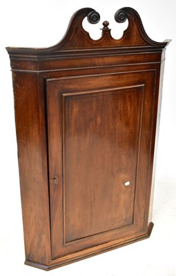 Lot 87 - A 19th century mahogany corner cupboard with...