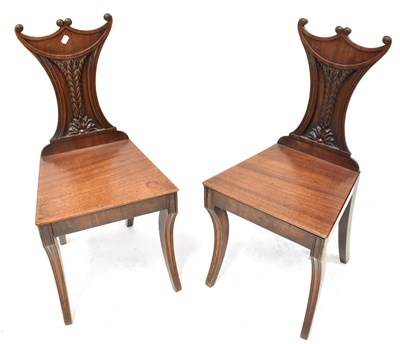 Lot 79 - A pair of 19th century mahogany hall chairs...