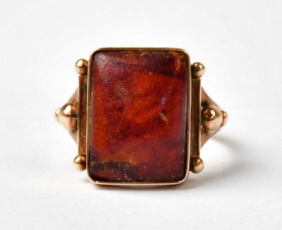 Lot 1036 - A yellow metal ring set with a rectangular...