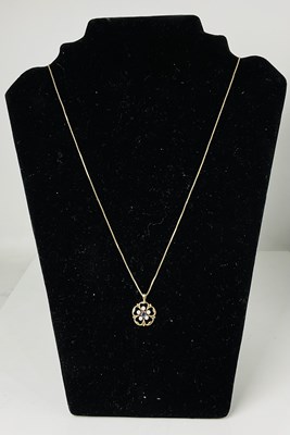 Lot 614 - A 9ct gold fine link chain set with 9ct gold...
