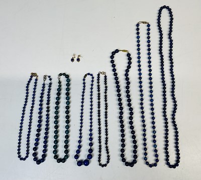 Lot 658 - Seven lapis lazuli and sodalite bead necklaces...