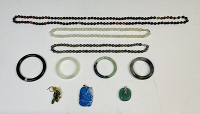 Lot 640 - A group of bead necklaces, Chinese bangles, a...