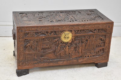 Lot 1595 - A camphorwood chest decorated with village...