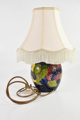 Lot 1416 - WALTER MOORCROFT; a baluster table lamp in the...