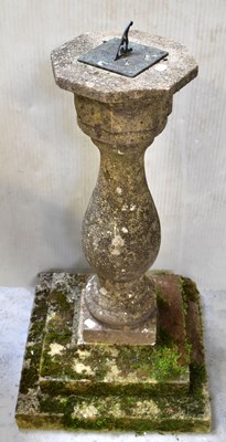 Lot 81 - A reconstitued stone garden sundial with metal...