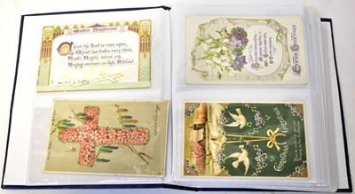 Lot 679 - A postcard album containing Edwardian and...