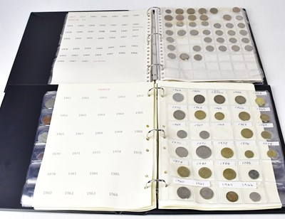 Lot 981 - Two coin folders containing a variety of UK...