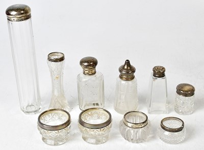 Lot 726 - A collection of cut glass silver topped salts...