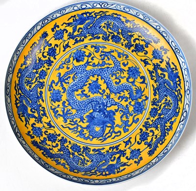 Lot 158 - A Chinese Qing Dynasty shallow bowl painted...
