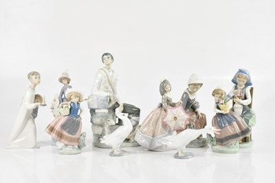 Lot 1739 - LLADRO; a collection of eight figures...