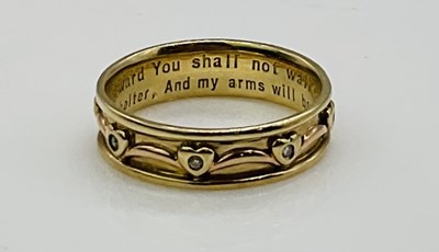 Lot 626 - A 9ct yellow gold diamond set band ring, with...