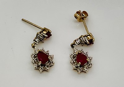 Lot 630 - A pair of 9ct yellow gold ruby and diamond...