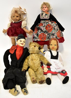 Lot 320 - A collection of dolls and teddy bears...
