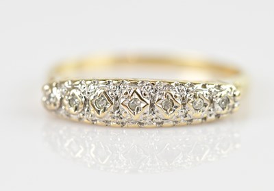 Lot 2574 - A yellow metal diamond set half eternity ring,...