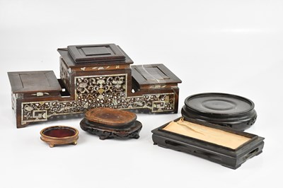 Lot 1632 - A collection of Chinese hardwood stands,...