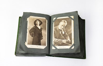 Lot 757 - An early 20th century postcard album...