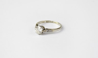 Lot 994 - An 18ct white gold solitaire diamond ring with...