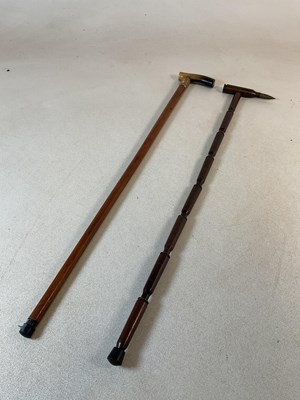Lot 271 - A trench art walking cane, made of nine shell...