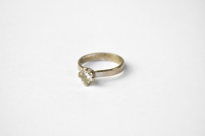 Lot 996 - An 18ct white gold solitaire diamond ring in...