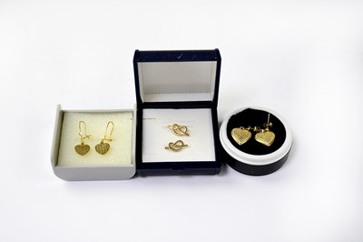 Lot 1193 - Three pairs of yellow metal stud earrings, one...